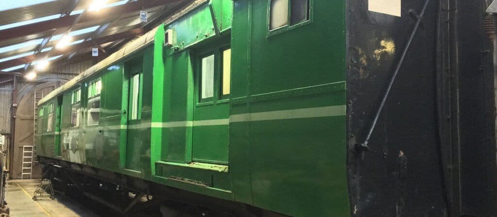 TPO carriage 2977 inside the workshop at Downpatrick in the process of being cleaned.